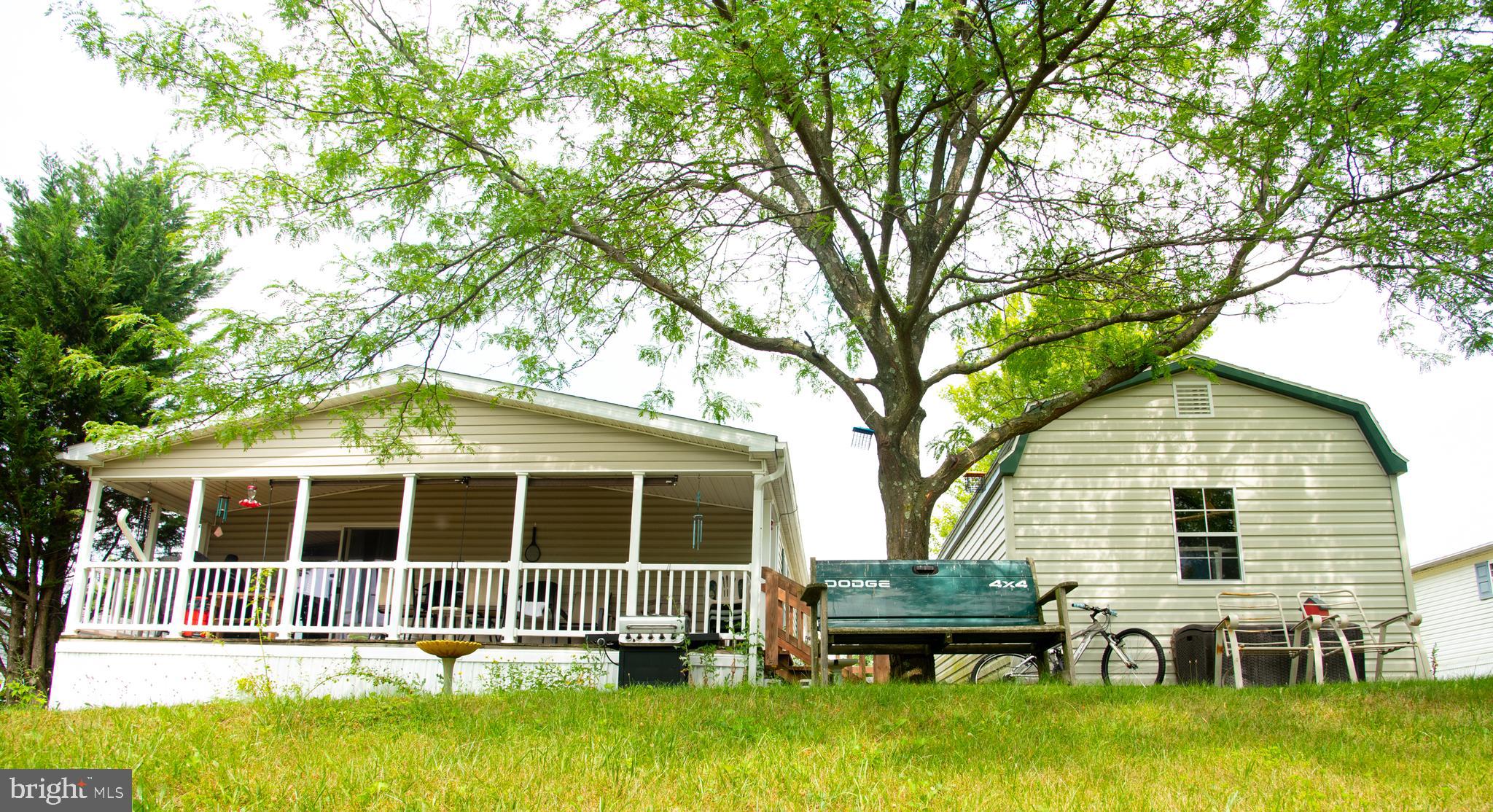 104 Raptor Drive Hanover, PA 17331 - Photo 7 of 30 a backyard of a house with yard table and chairs