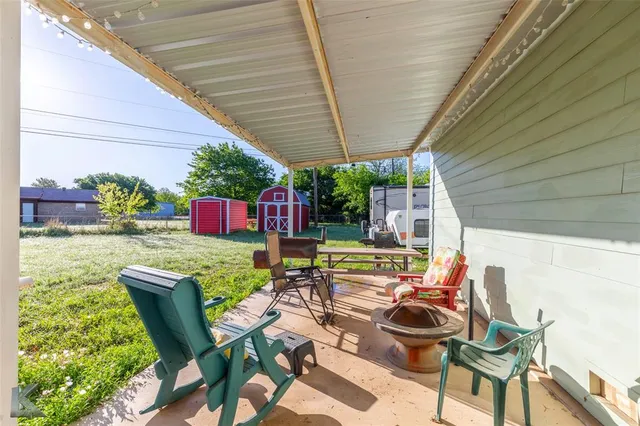 a view of yard with swimming pool and green space