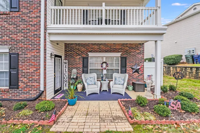 a view of a patio with table and chairs and potted plants
