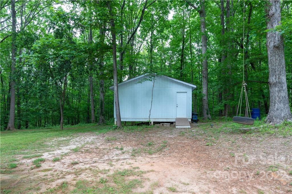 4355 Lockhart Road Sharon, SC 29742 - Photo 25 of 34 a backyard of a house with lots of green space