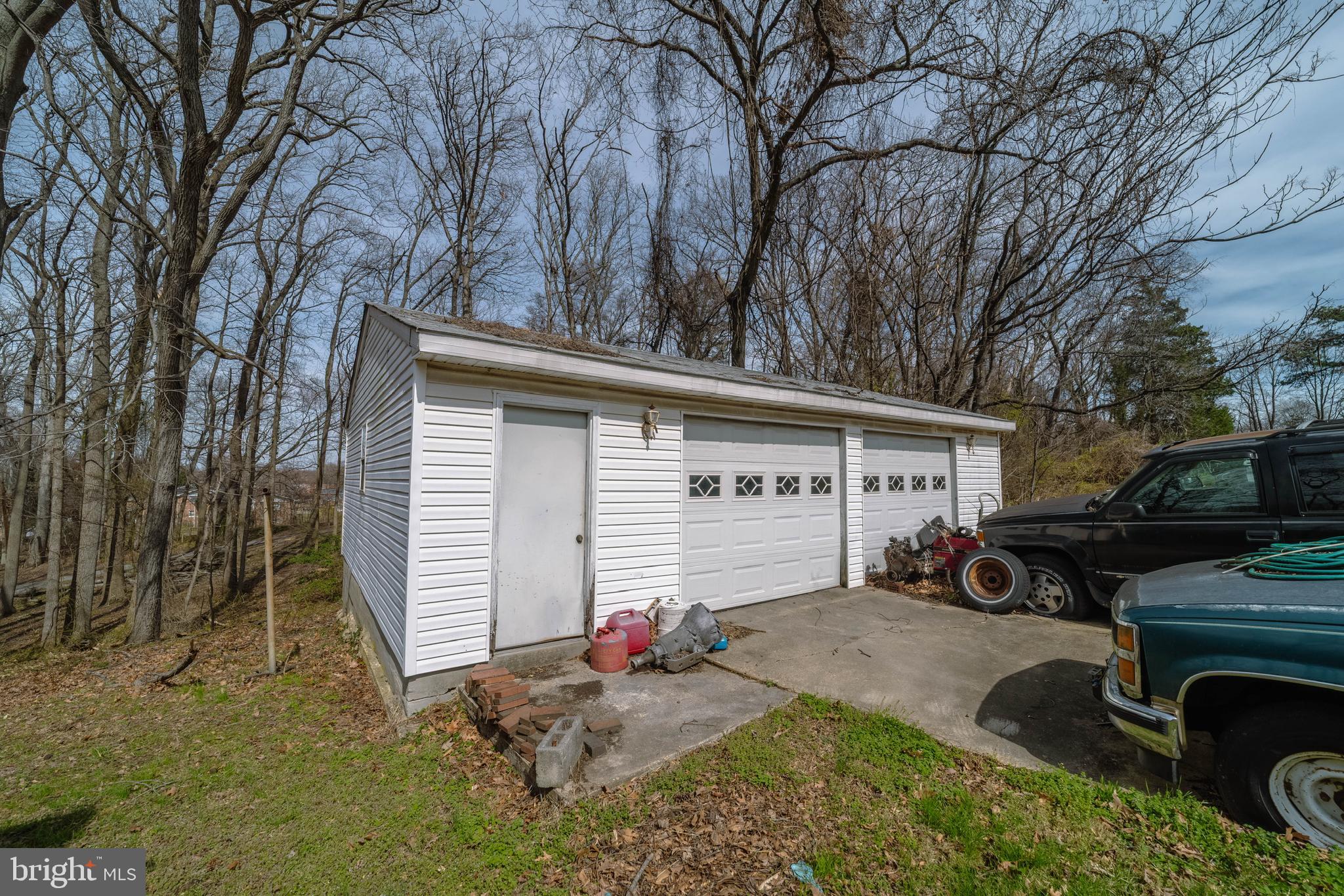 6900 Temple Hill Road Temple Hills, MD 20748 - Photo 41 of 43 a view of a house with a yard and garage
