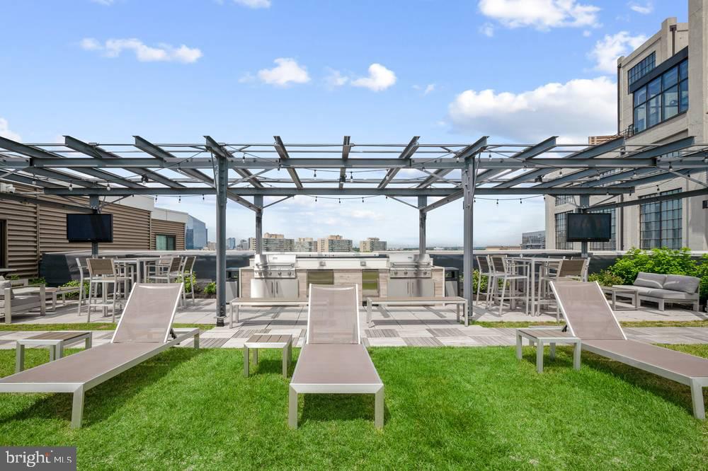 1901-39 Callowhill Street, Unit 912 Philadelphia, PA 19130 - Photo 5 of 17 a view of a swimming pool with a patio