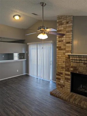 a room with fireplace and wooden floor