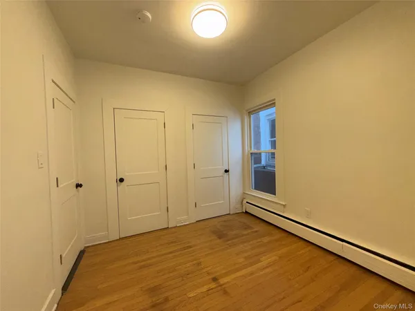 a view of an empty room and window
