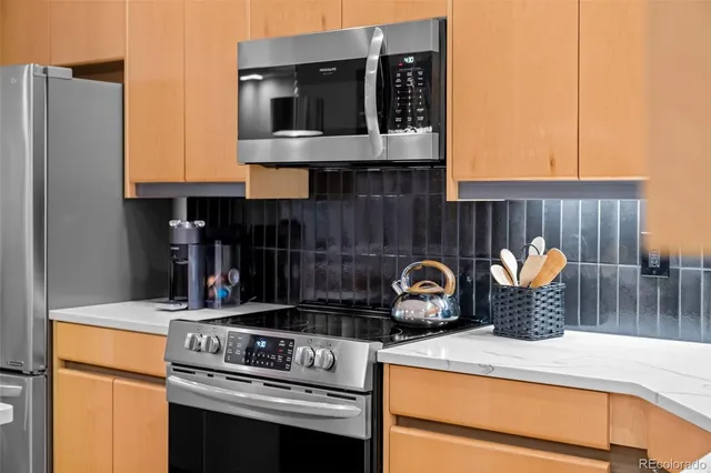 a kitchen with a stove and a microwave