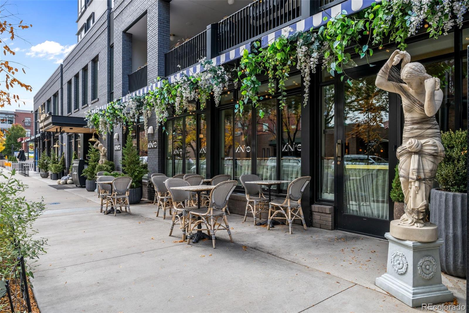 83 South Monroe Street Denver, CO 80209 - Photo 19 of 19 a view of a patio with a table and chairs and potted plants