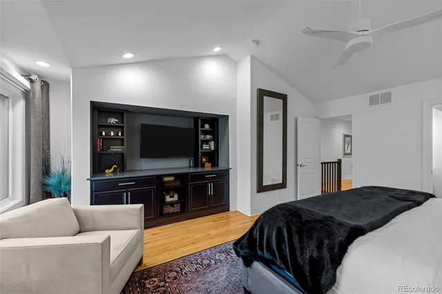 a bedroom with a bed and a couch