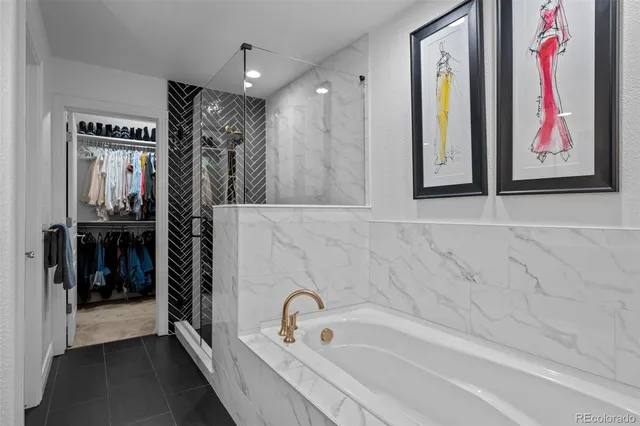 a bathroom with a bathtub and a shower