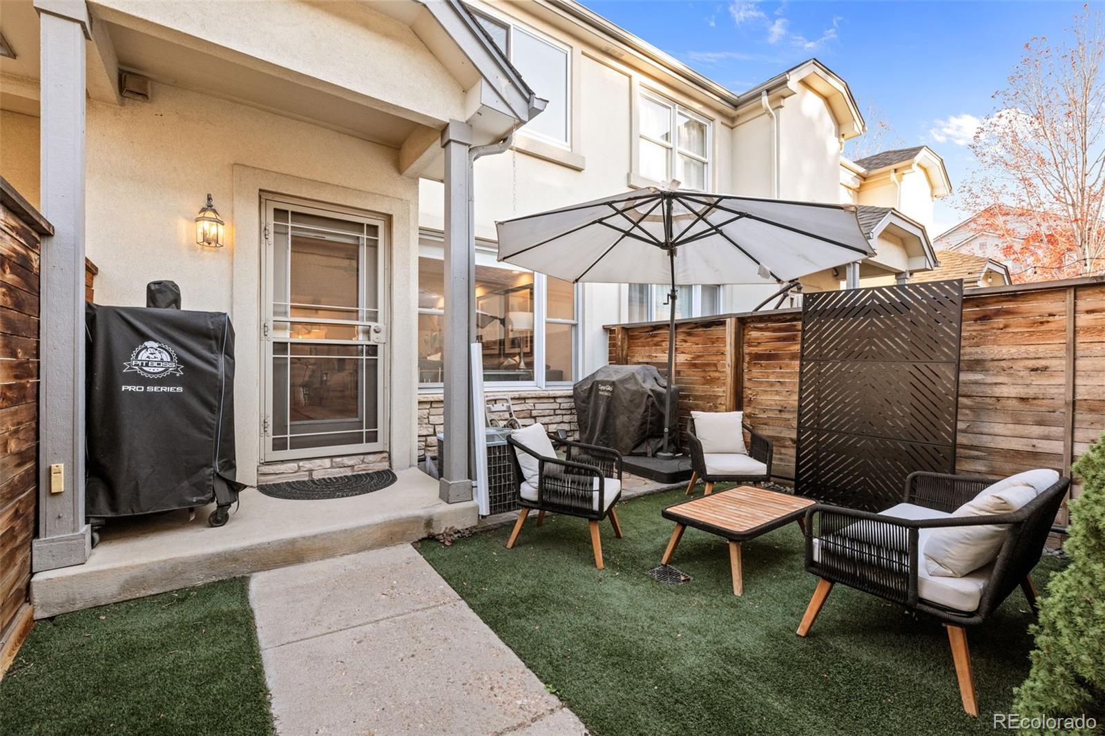 83 South Monroe Street Denver, CO 80209 - Photo 10 of 19 a backyard of a house with table and chairs