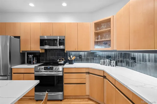 a kitchen with a stove a sink and a microwave