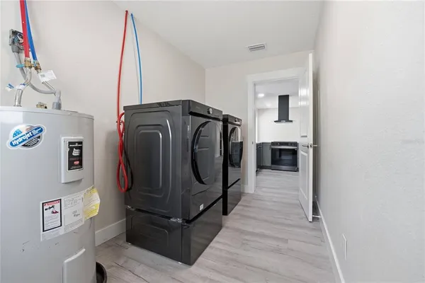 a utility room with dryer and washer