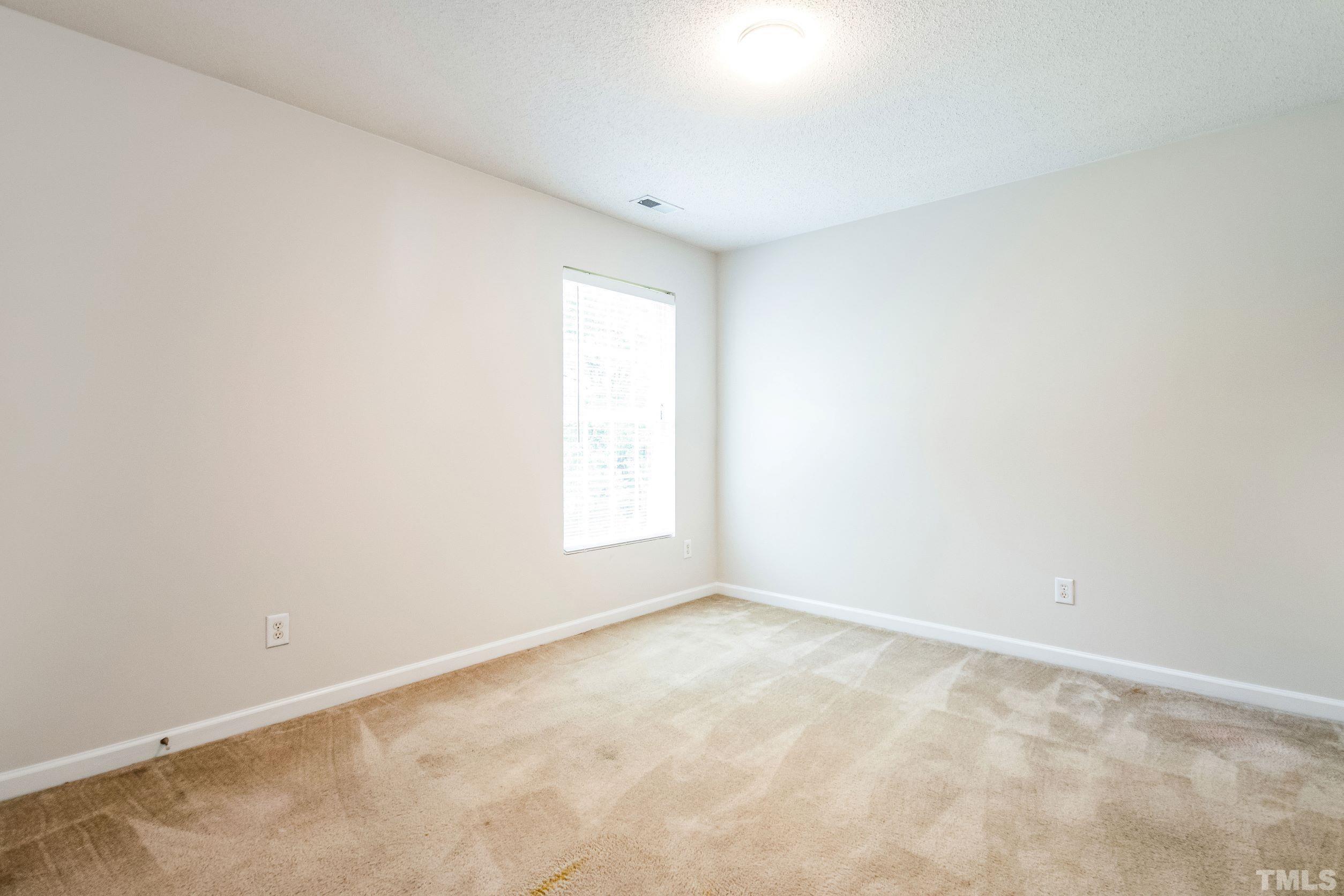 4827 Shallowbrook Trail Raleigh, NC 27616 - Photo 13 of 30 an empty room with a empty space and a window