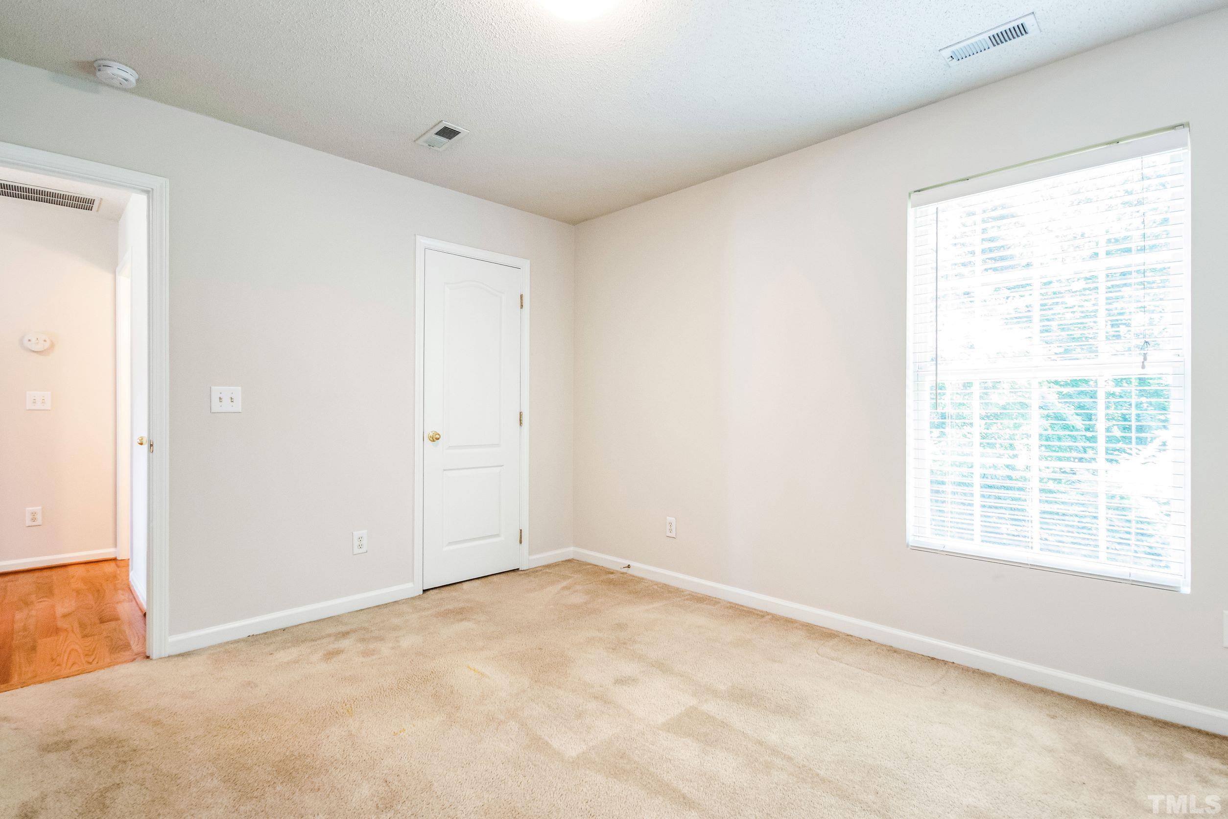 4827 Shallowbrook Trail Raleigh, NC 27616 - Photo 14 of 30 a view of an empty room with a window