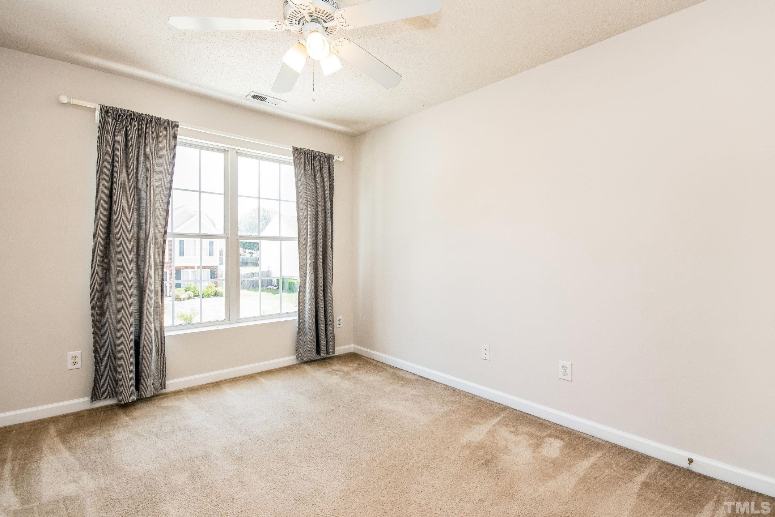 4827 Shallowbrook Trail Raleigh, NC 27616 - Photo 15 of 30 an empty room with a empty space and a window