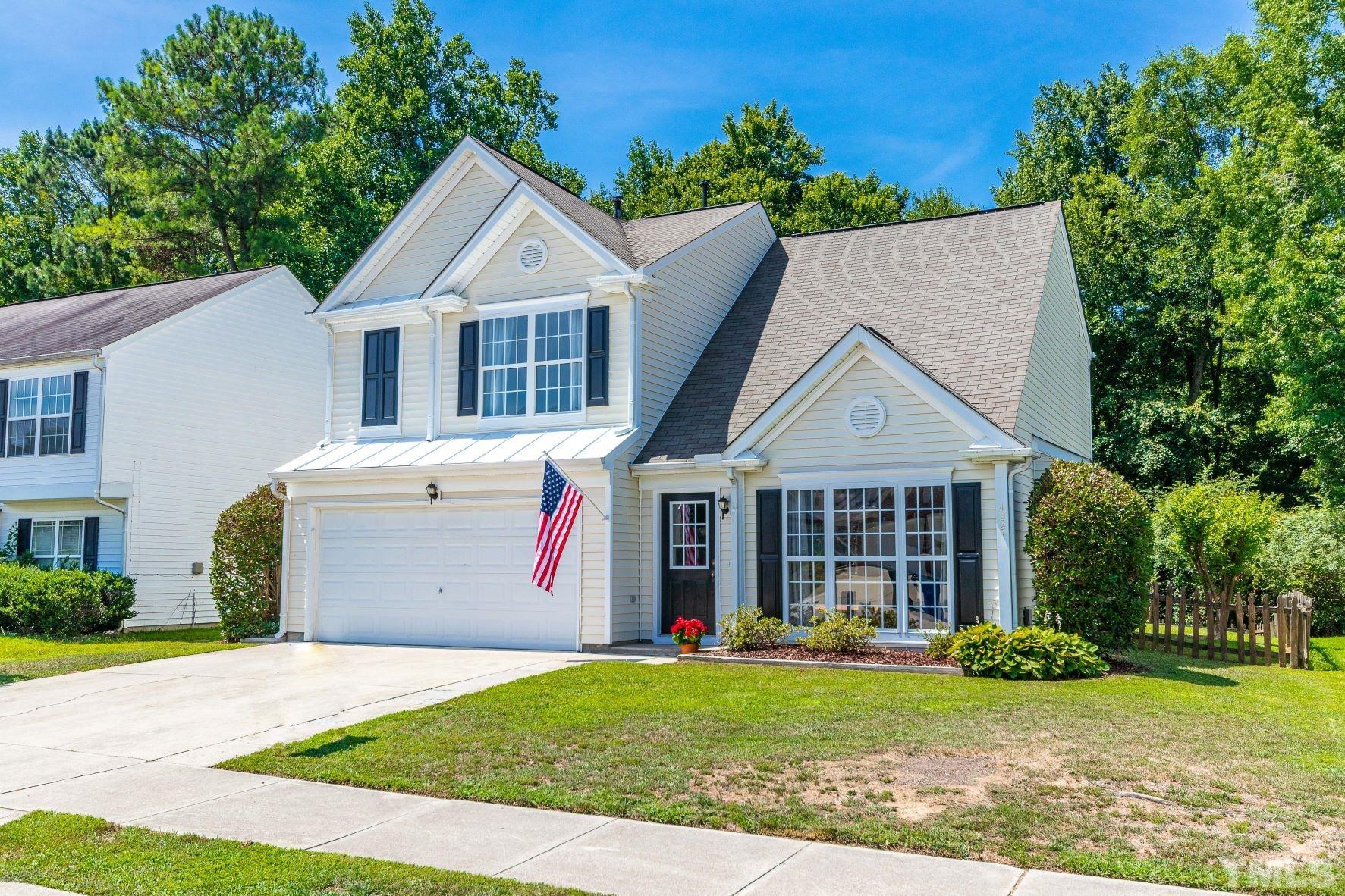 4827 Shallowbrook Trail Raleigh, NC 27616 - Photo 30 of 30 a front view of a house with a yard and garage