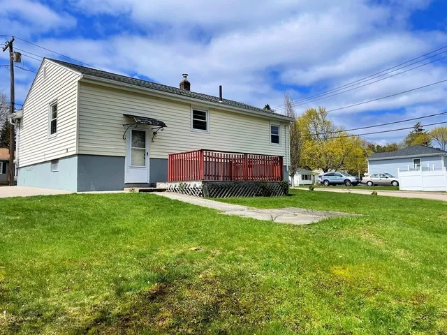 a view of a house with a back yard