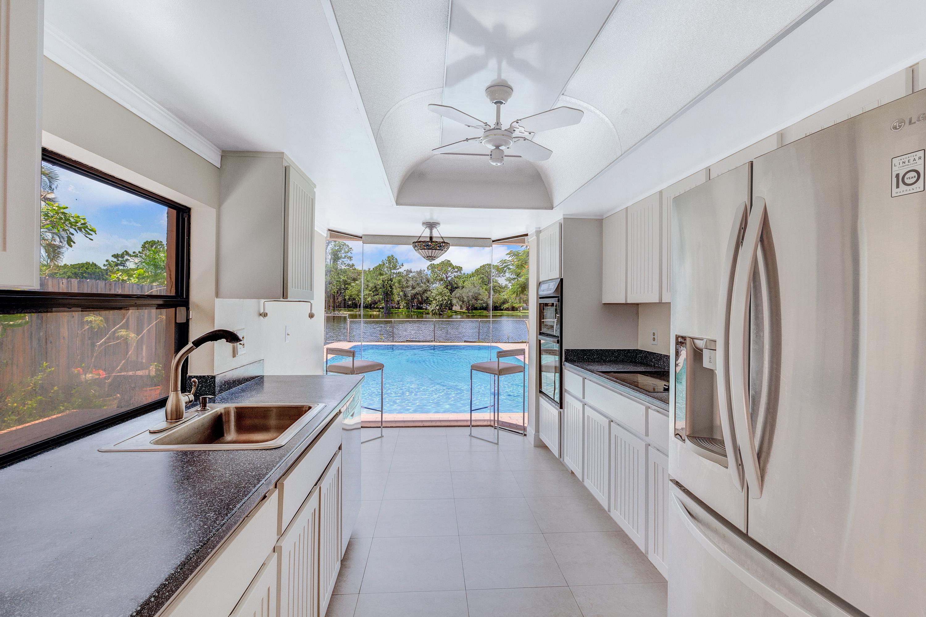 6488 Sweet Maple Lane Boca Raton, FL 33433 - Photo 13 of 38 Kitchen with Gorgeous Picture Window