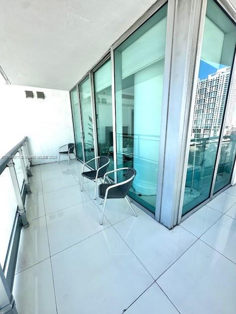 92 Southwest 3rd Street, Unit 1410 Miami, FL 33130 - Photo 19 of 40 a view of a room with sliding glass door and mountain view