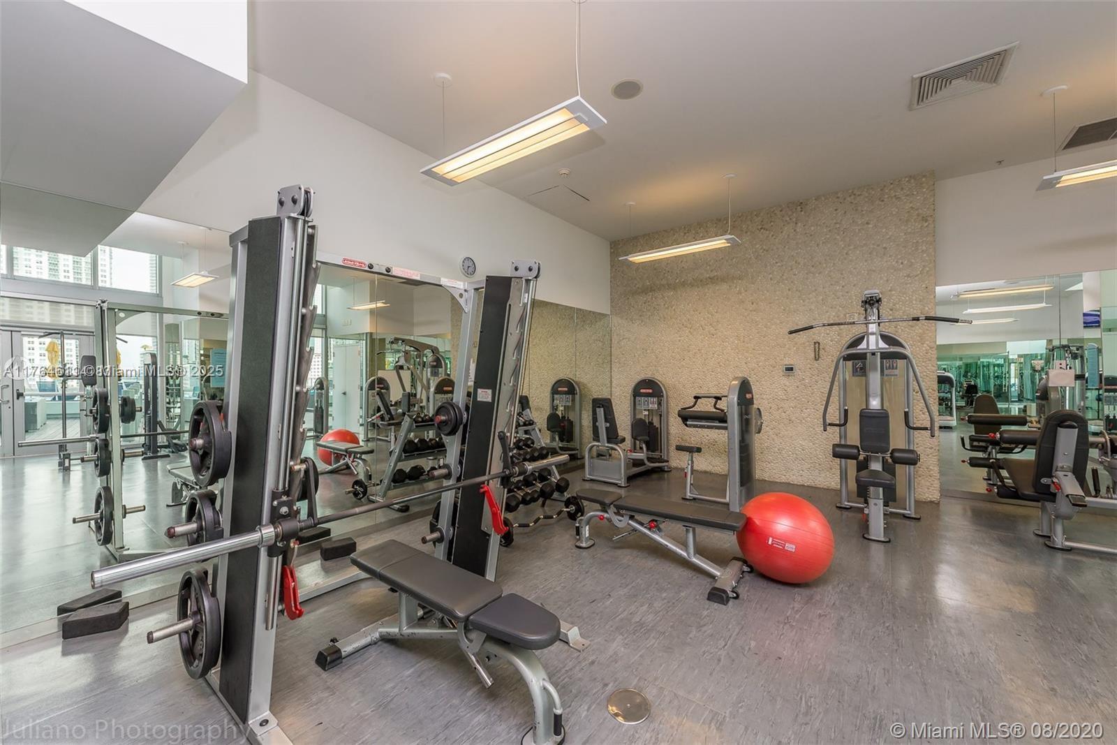 92 Southwest 3rd Street, Unit 1410 Miami, FL 33130 - Photo 23 of 40 a view of a room with gym equipment