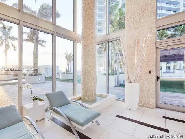 a en suite bathroom with a tub shower and sink