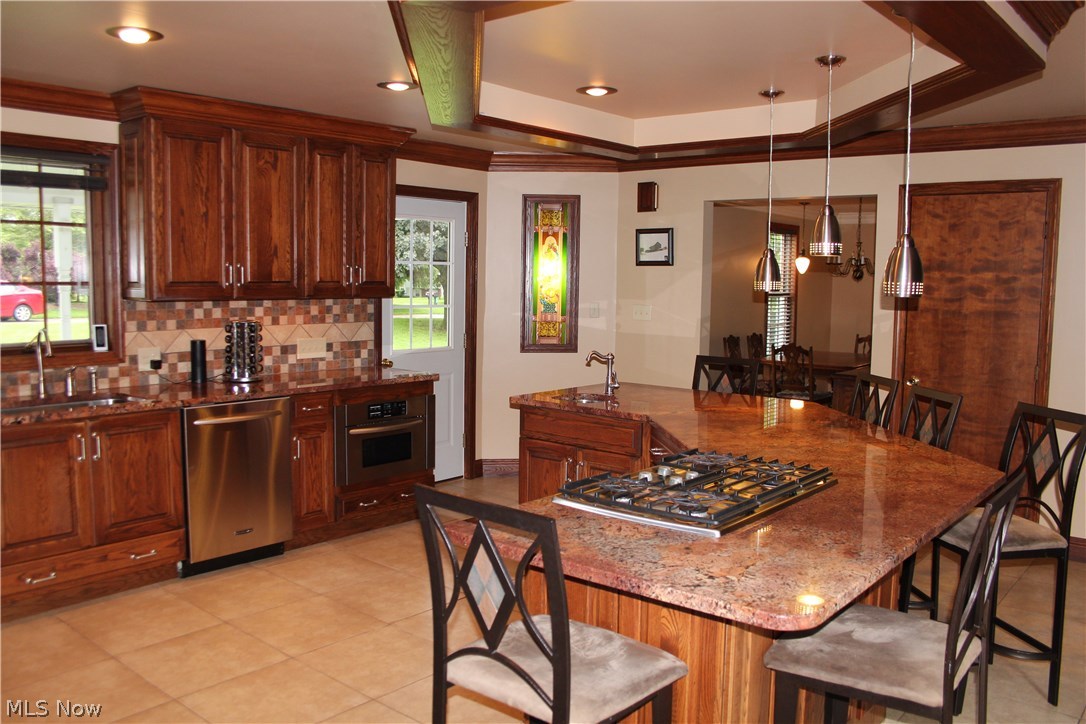 156 Johnson Road Wadsworth, OH 44281 - Photo 2 of 20 Updated Chef's Kitchen complete w granite, ss appliances including double oven, huge island with prep sink, gas range, and seating for 6 or more!