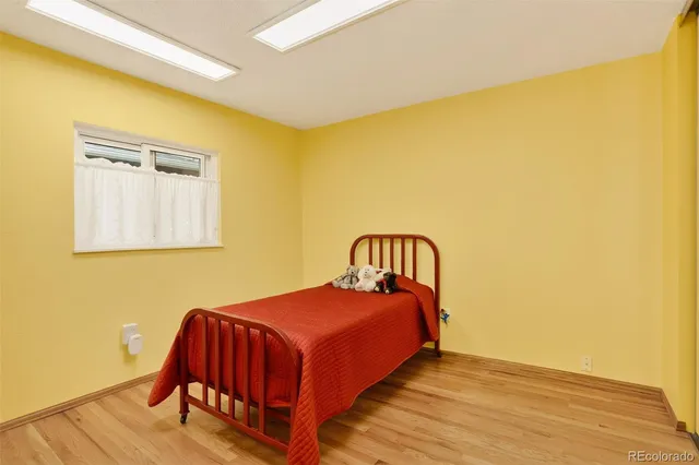 a bedroom with a bed and a table