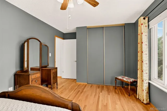 a bedroom with a bed and a table