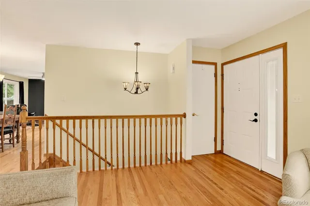 a view of hallway with wooden floor