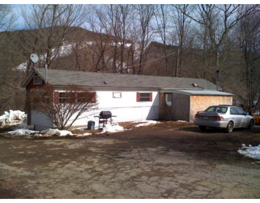 67 Adamsville Road Colrain, MA 01340 - Photo 1 of 1 a view of parking and a yard