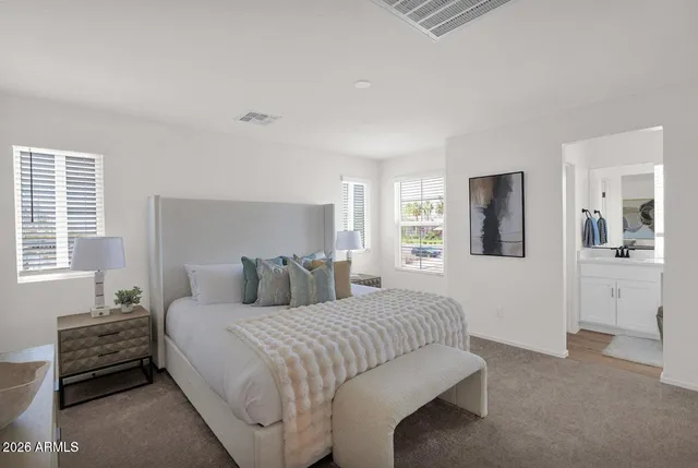 a bedroom with a bed and a cabinets