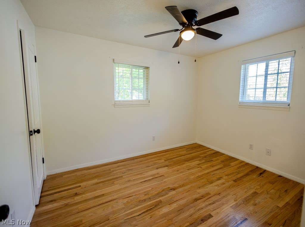 8828 Edgehill Road Mentor, OH 44060 - Photo 14 of 24 Empty room with ceiling fan and light wood-type flooring