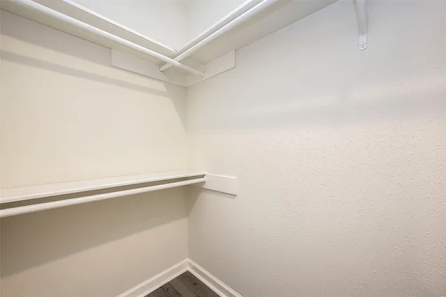 a view of an empty walk in closet