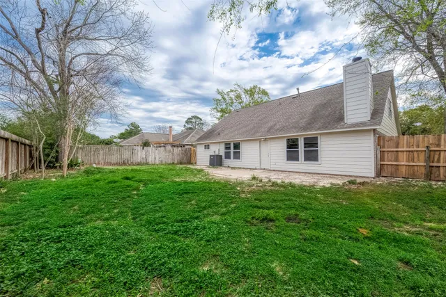 a aerial view of house with backyard