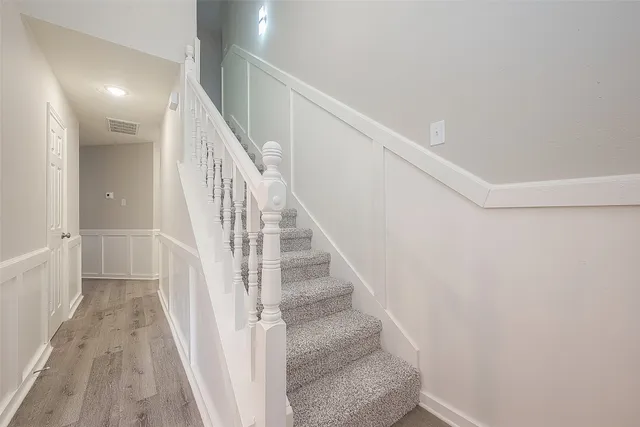 a view of staircase with white walls and white walls