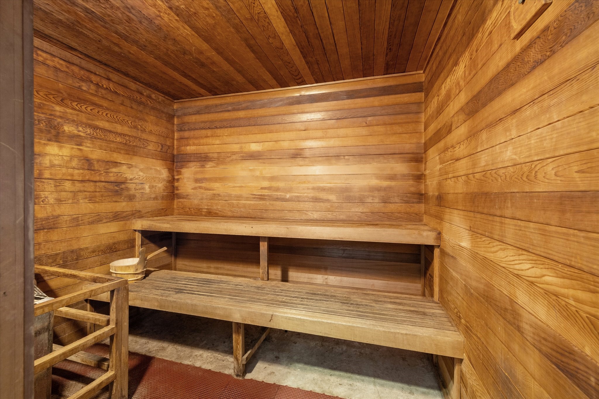 3505 Sage Road, Unit 1104 Houston, TX 77056 - Photo 28 of 31 Relax and recharge in the community sauna, a private wellness amenity designed for comfort and relaxation. The warm wood interior creates a tranquil atmosphere that encourages residents to unwind after a workout or long day. With tiered seating and traditional sauna design, this space provides a peaceful retreat where residents can enjoy the health benefits of heat therapy within the comfort of their own building.