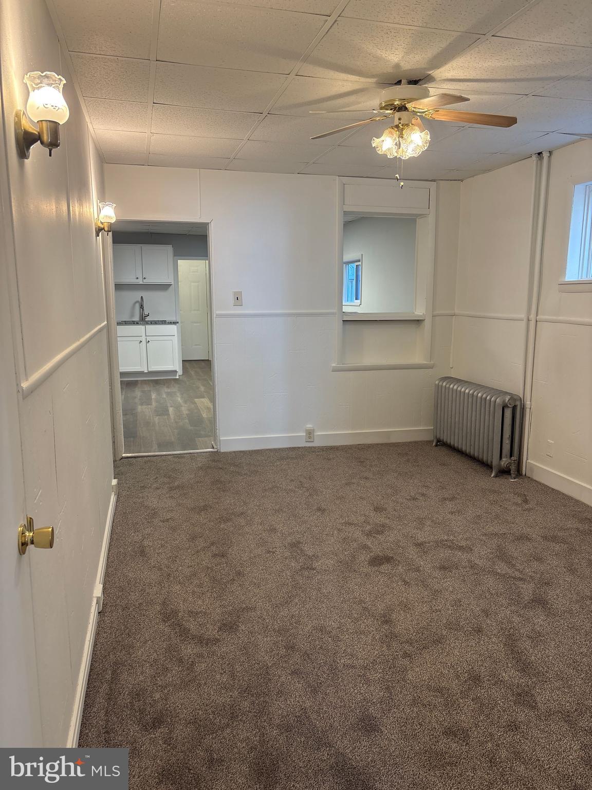 562 West Philadelphia Street York, PA 17401 - Photo 4 of 20 en empty room with windows and ceiling fan