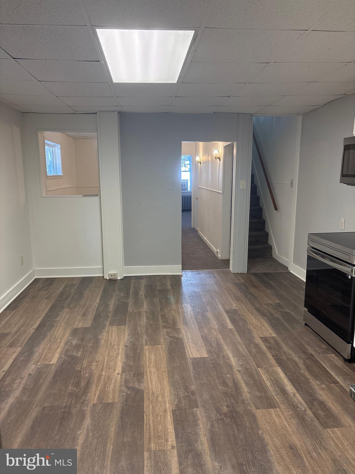 562 West Philadelphia Street York, PA 17401 - Photo 7 of 20 a view of a livingroom with wooden floor and stairs