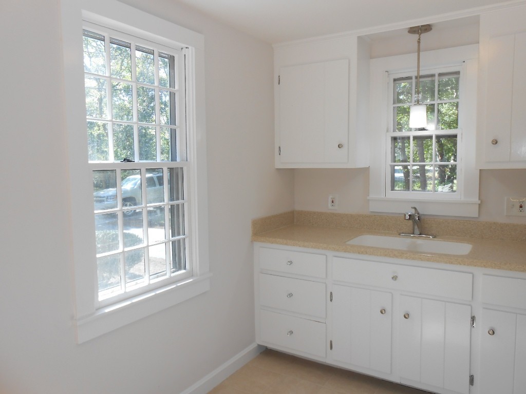 17 Cap'n Lijah's Road Barnstable, MA 02632 - Photo 8 of 26 a kitchen with cabinets appliances and a window