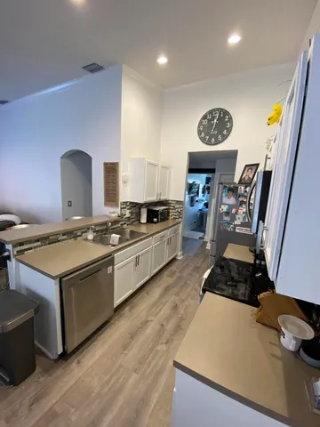 a kitchen with a stove and a refrigerator