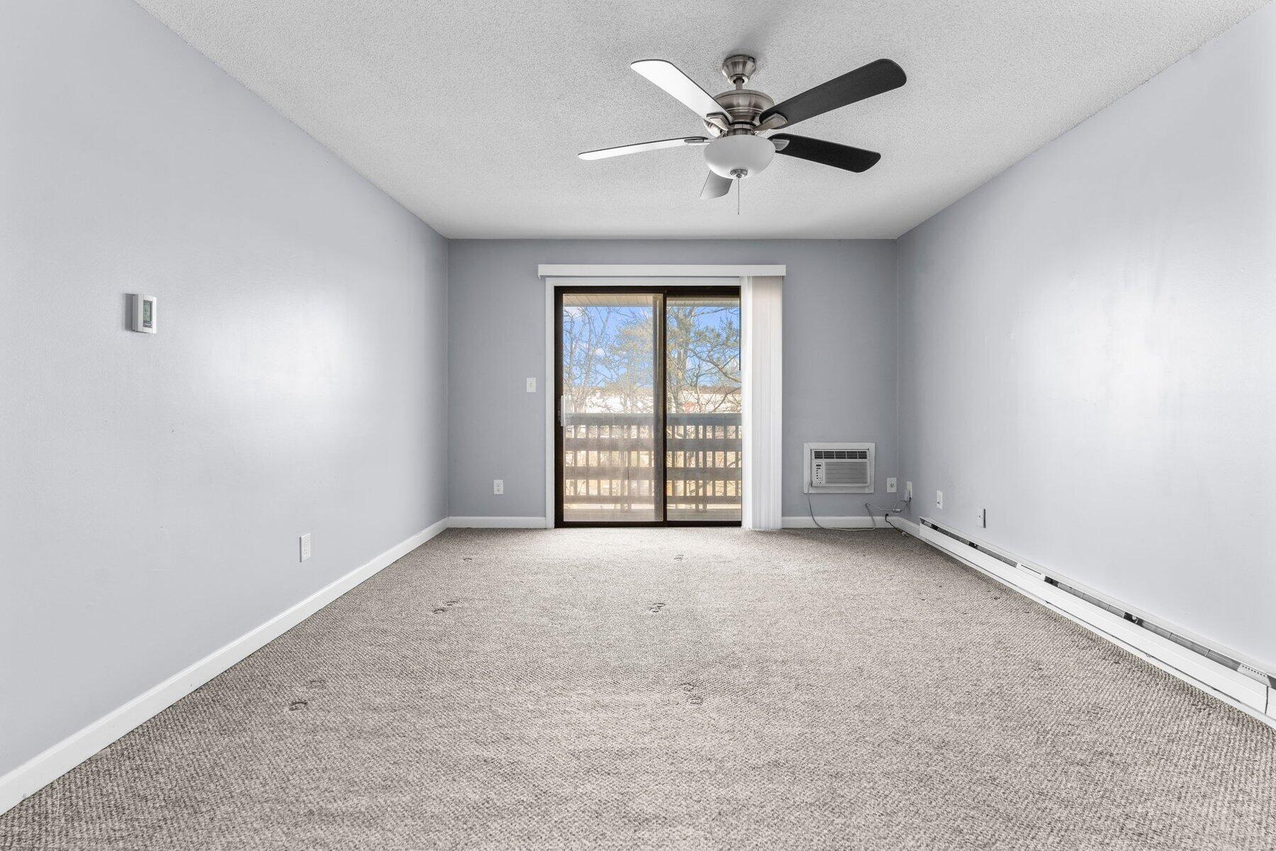 800 Bearses Way, Unit 3NF Hyannis, MA 02601 - Photo 22 of 28 an empty room with windows and fan