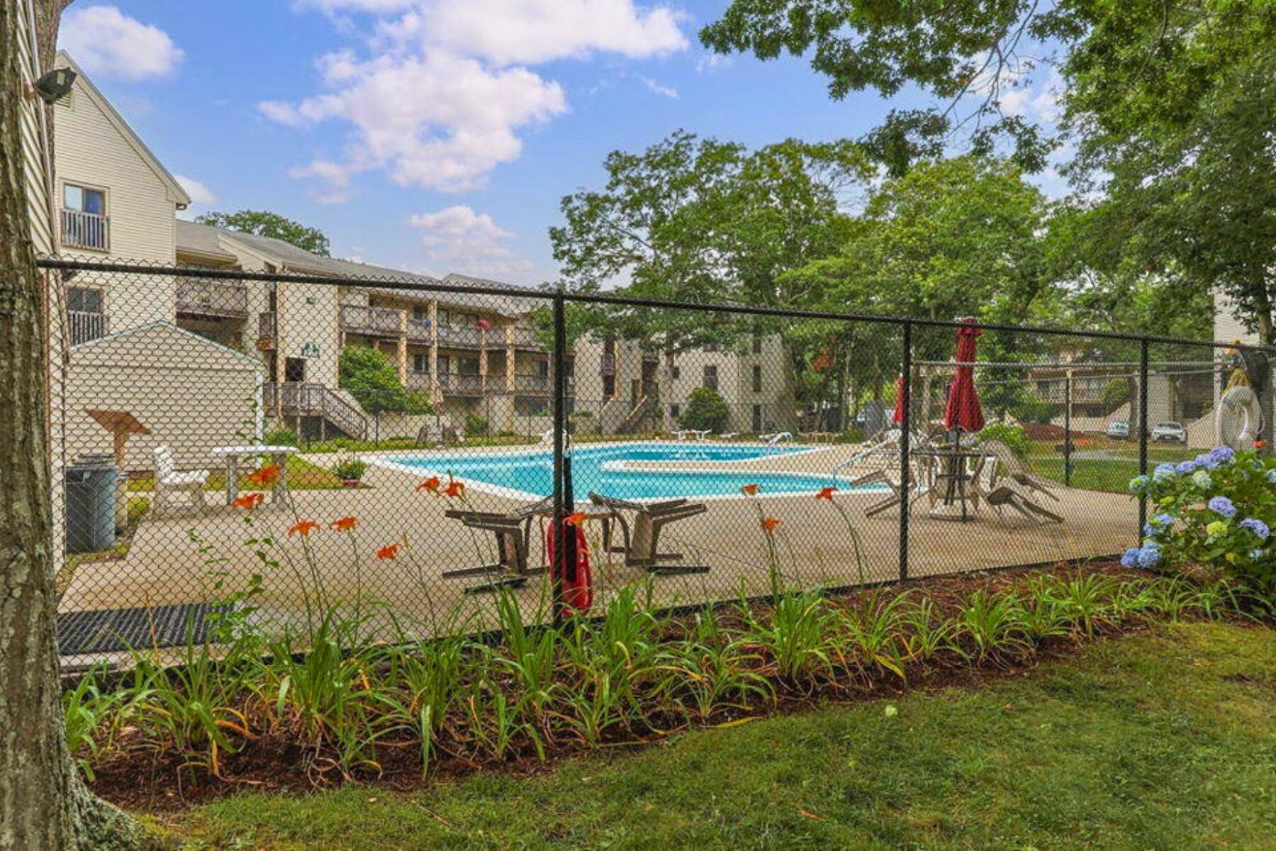 800 Bearses Way, Unit 3NF Hyannis, MA 02601 - Photo 26 of 28 a view of a park with swings and slides