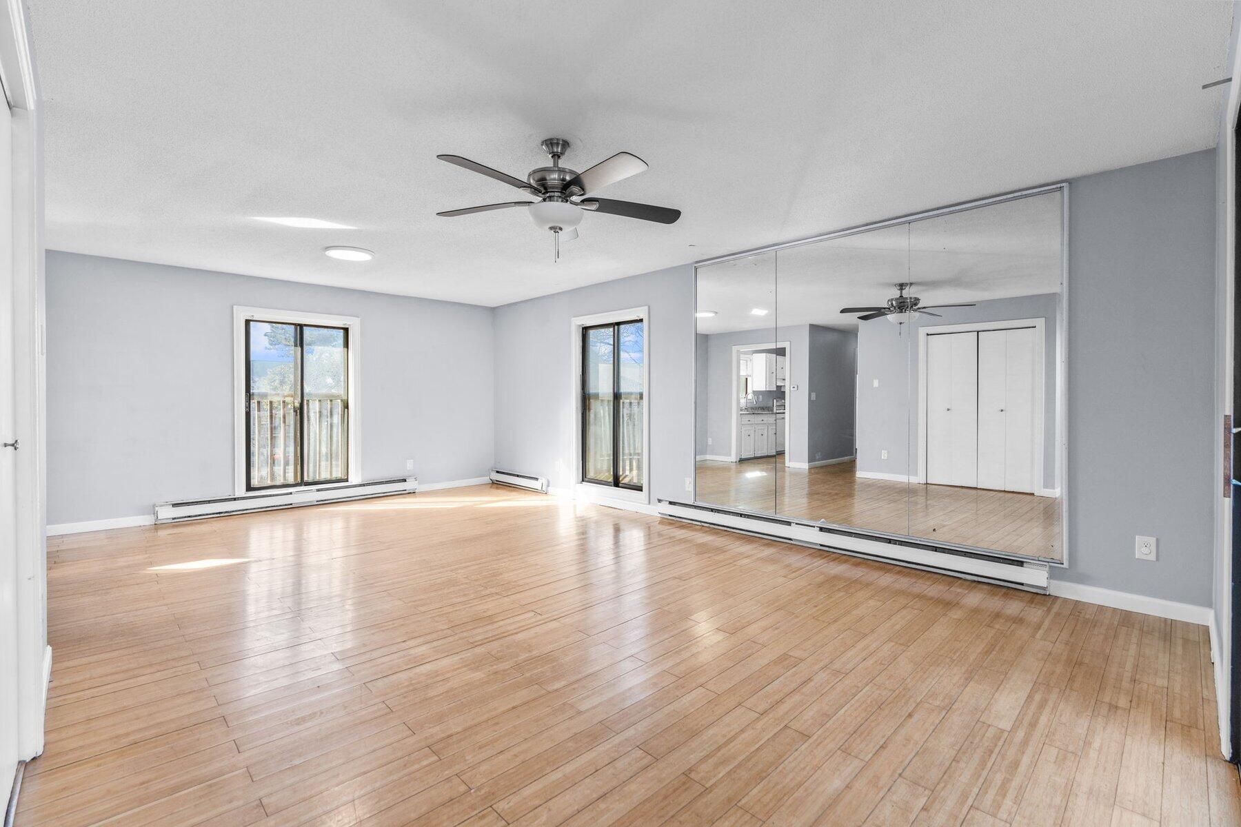 800 Bearses Way, Unit 3NF Hyannis, MA 02601 - Photo 9 of 28 a view of an empty room with wooden floor and a window