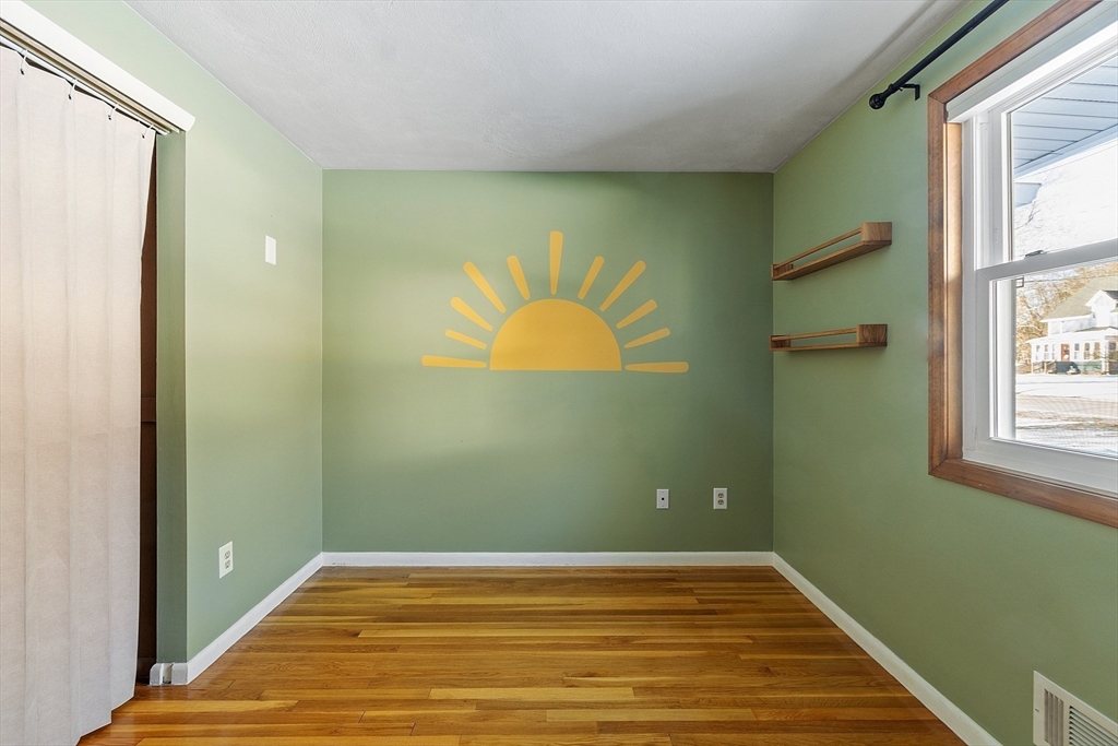 187 Mill Road Chelmsford, MA 01824 - Photo 13 of 32 a view of a room with wooden floor and a window