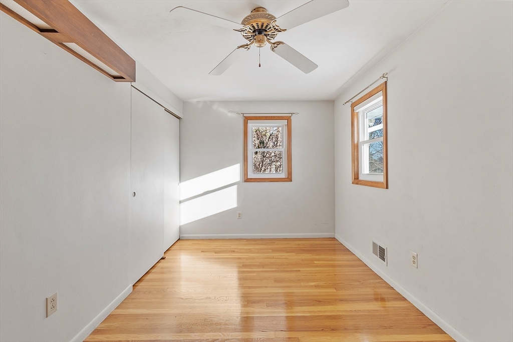 187 Mill Road Chelmsford, MA 01824 - Photo 15 of 32 a view of a hallway with a chandelier