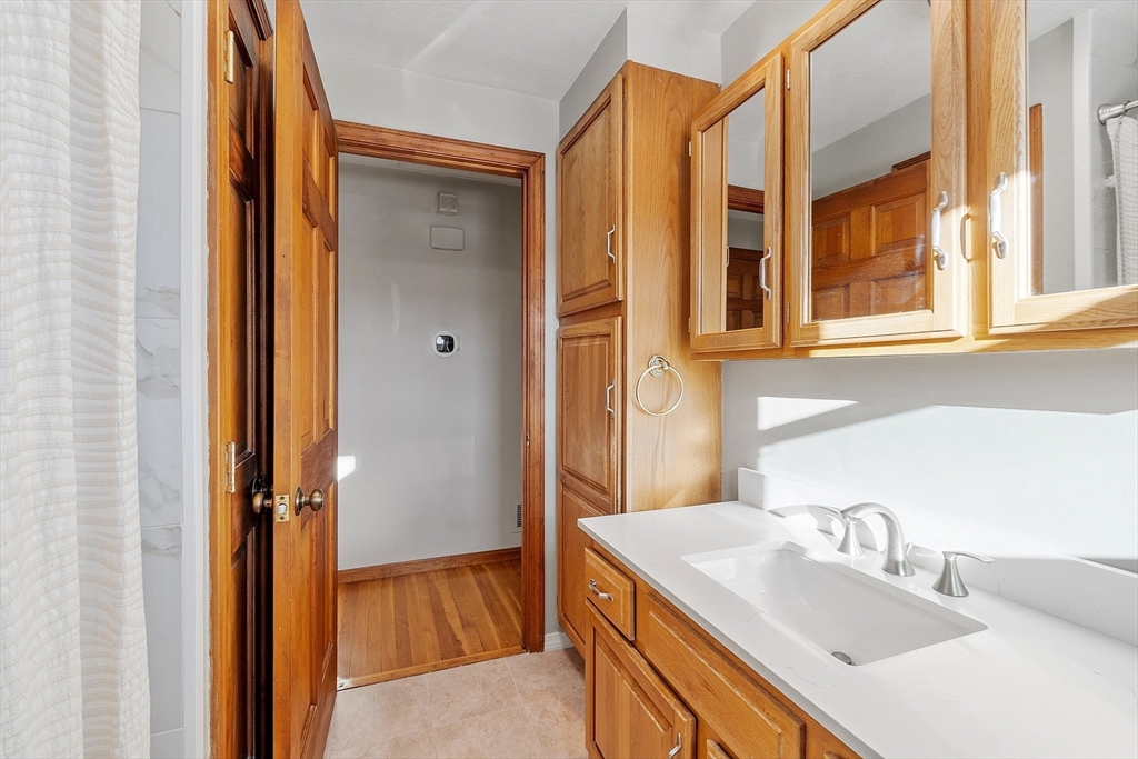 187 Mill Road Chelmsford, MA 01824 - Photo 16 of 32 a bathroom with a sink and a bathtub