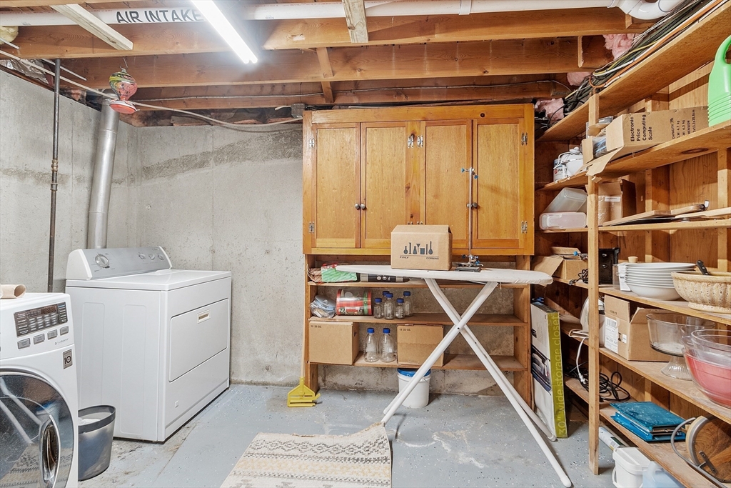 187 Mill Road Chelmsford, MA 01824 - Photo 25 of 32 a storage room with cabinets