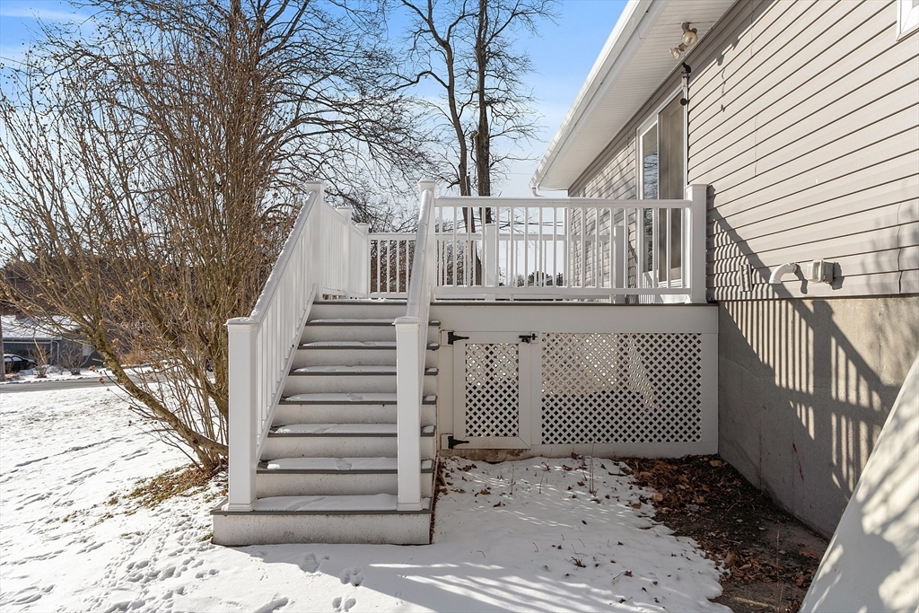 187 Mill Road Chelmsford, MA 01824 - Photo 27 of 32 a view of a building with a snow in the yard