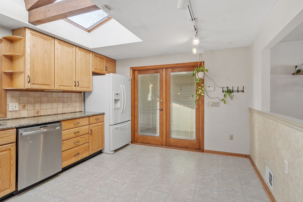 187 Mill Road Chelmsford, MA 01824 - Photo 4 of 32 a view of a kitchen with electric appliances