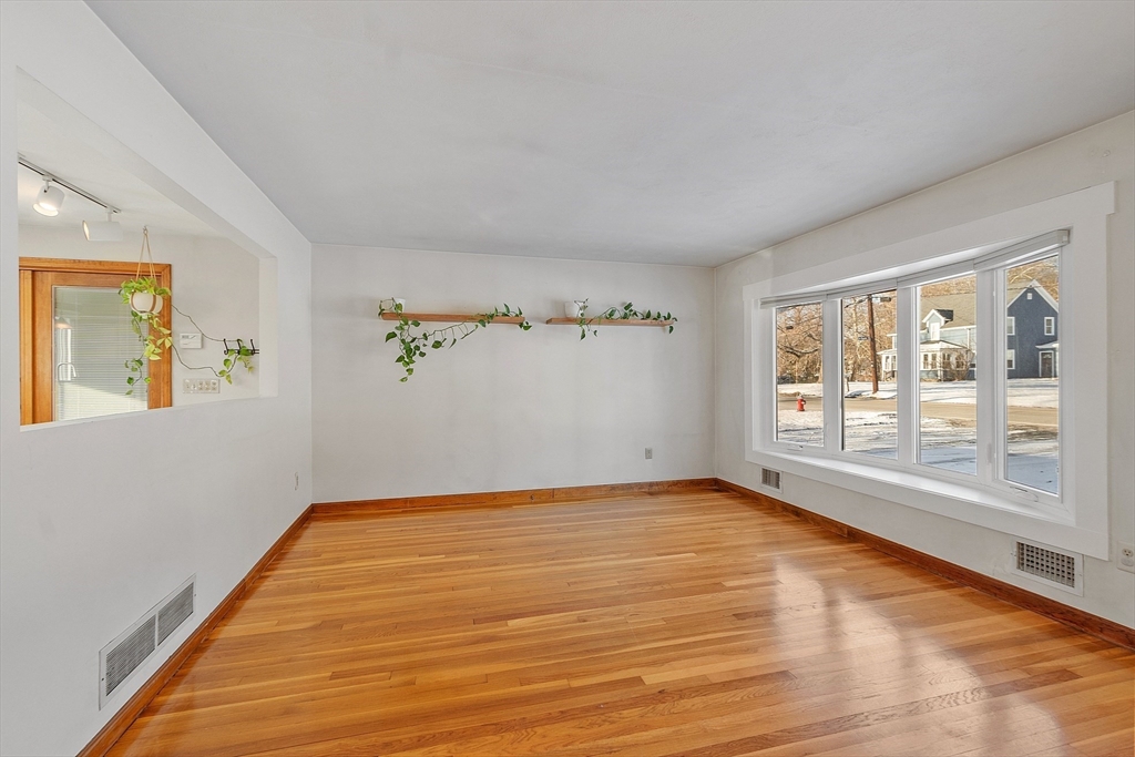 187 Mill Road Chelmsford, MA 01824 - Photo 6 of 32 a view of an empty room with a window