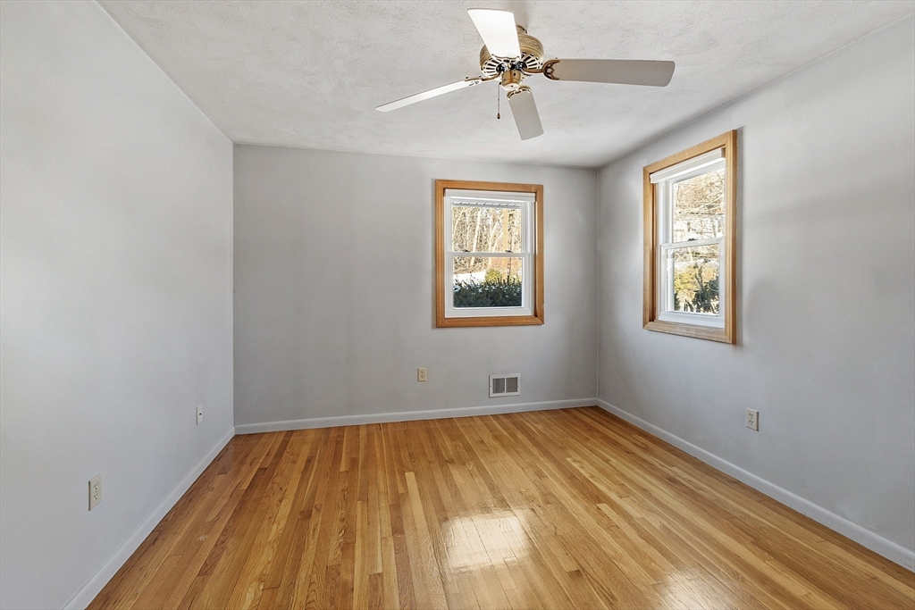 187 Mill Road Chelmsford, MA 01824 - Photo 9 of 32 a view of empty room with wooden floor